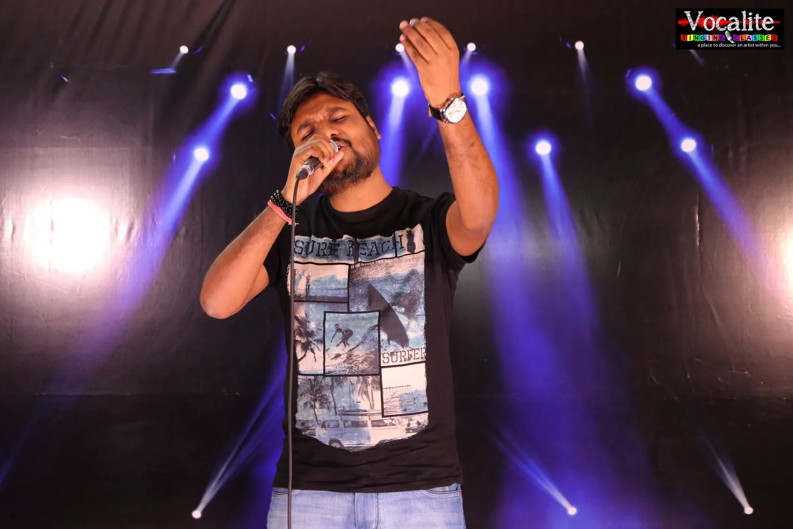 Vocal coach performing live on stage