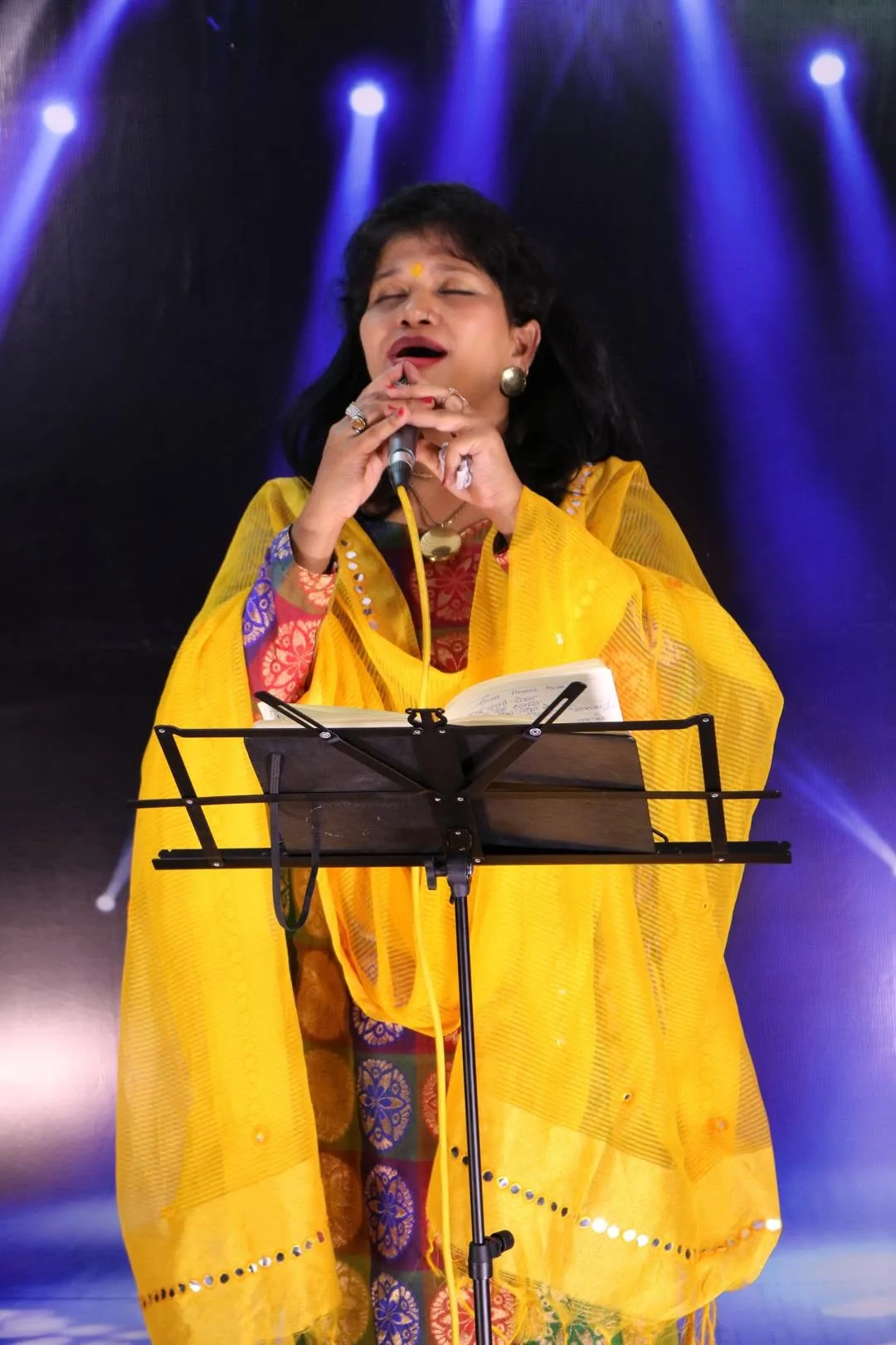 Young student singing at a Vocalite recital